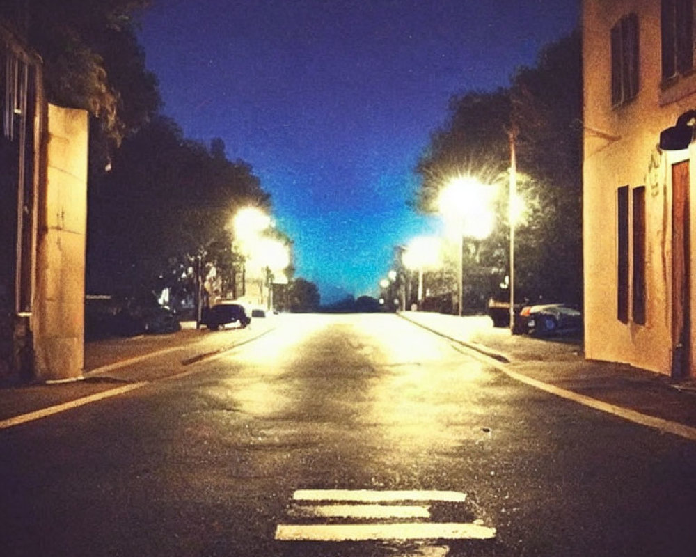 Dimly Lit Night Street with Yellow Streetlights and Twilight Sky Gradient