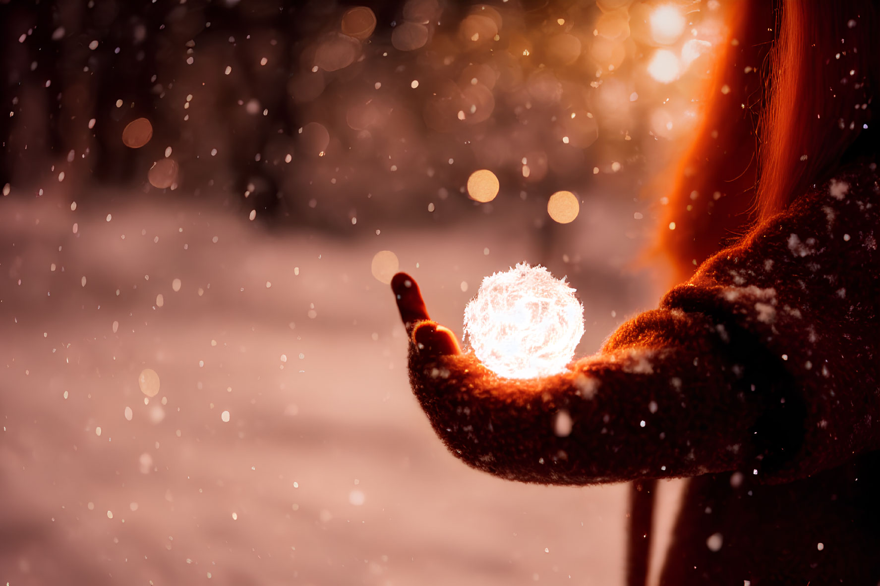 Person in Winter Coat Holding Glowing Orb in Snowfall