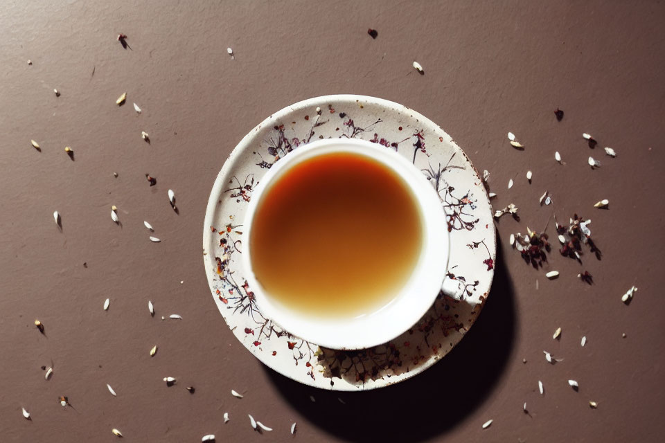 Loose Tea Leaves on Brown Surface: Relaxing and Aromatic Scene