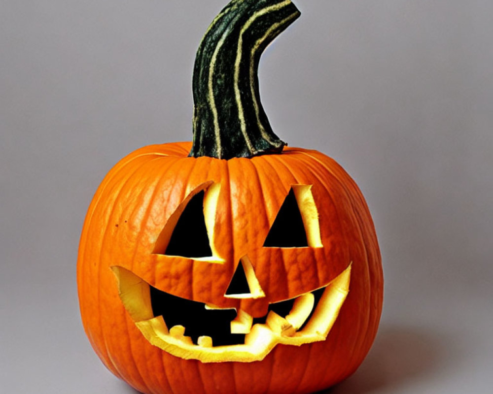 Smiling Jack-o'-lantern Pumpkin on Grey Background