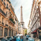 Parisian Street Watercolor: Cars, Eiffel Tower, Cloudy Sky