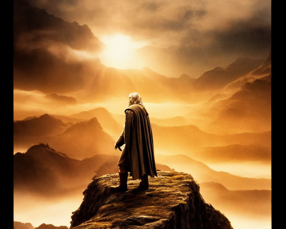 Cloaked Figure on Cliff Overlooking Dramatic Mountain Landscape