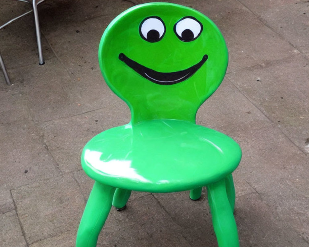 Bright Green Chair with Smiling Cartoon Face on Backrest