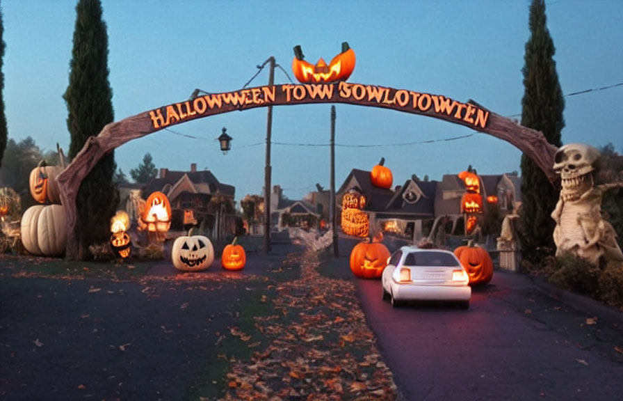 Car driving through Halloween-themed street with jack-o'-lanterns and skeletal figures.