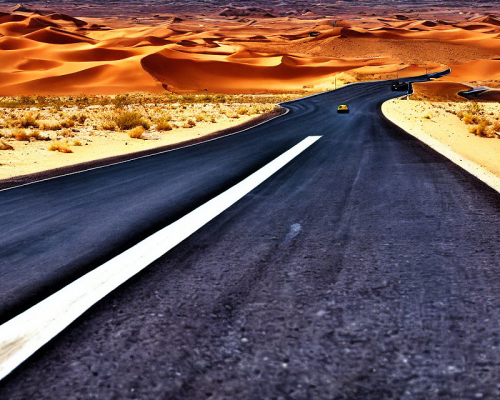 Desert landscape with winding road and yellow car