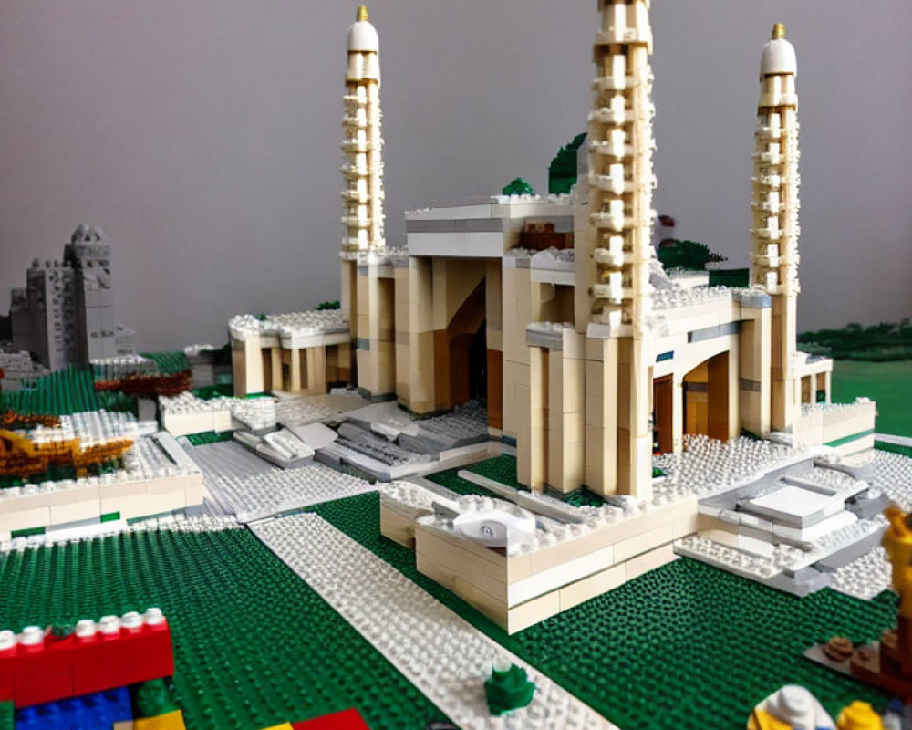 Detailed Lego model of grand building and colorful landscape.