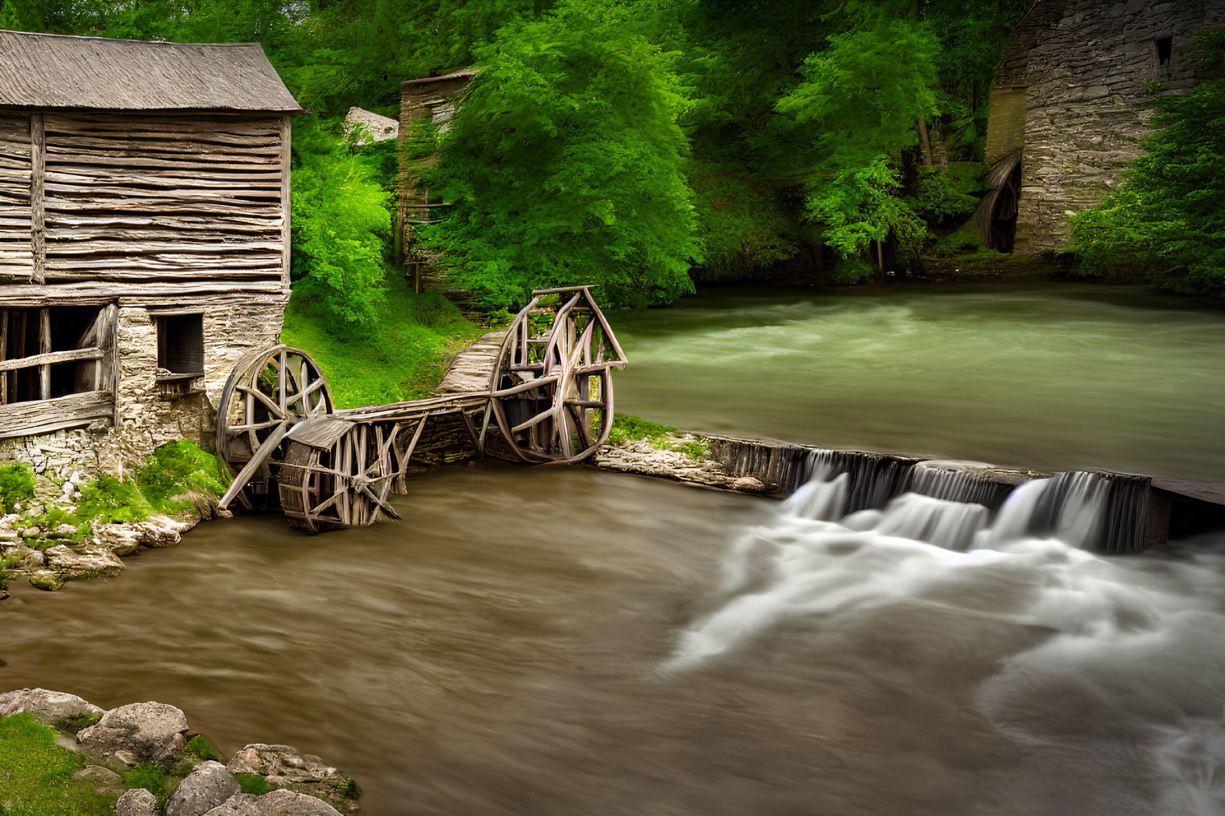 Rustic watermill by river with wooden wheels and waterfall