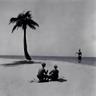 Beach scene with two people, palm trees, and walking figure