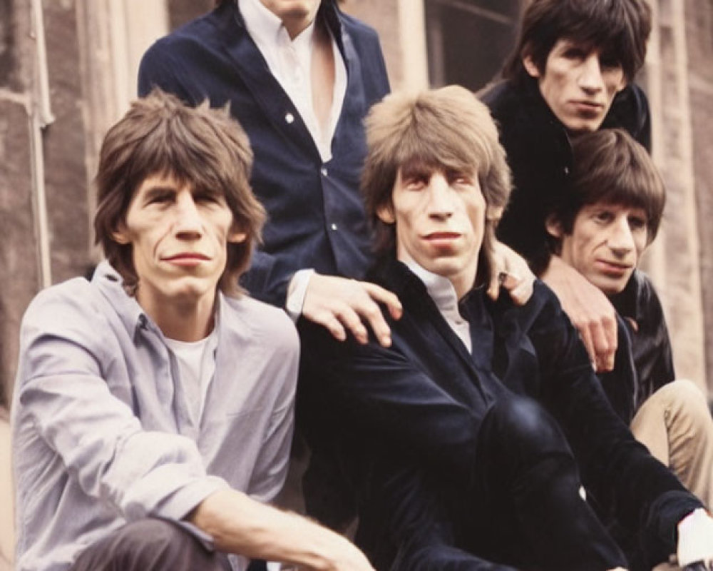 Vintage-Style Group Portrait: Five Men in Casual Poses with Shaggy Hairstyles