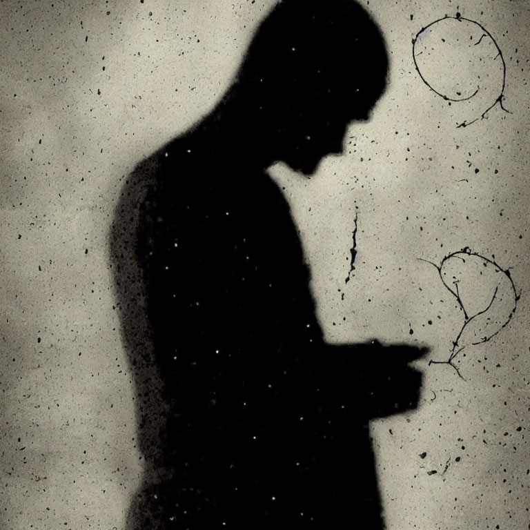 Silhouette of person against textured background with faint scribbles