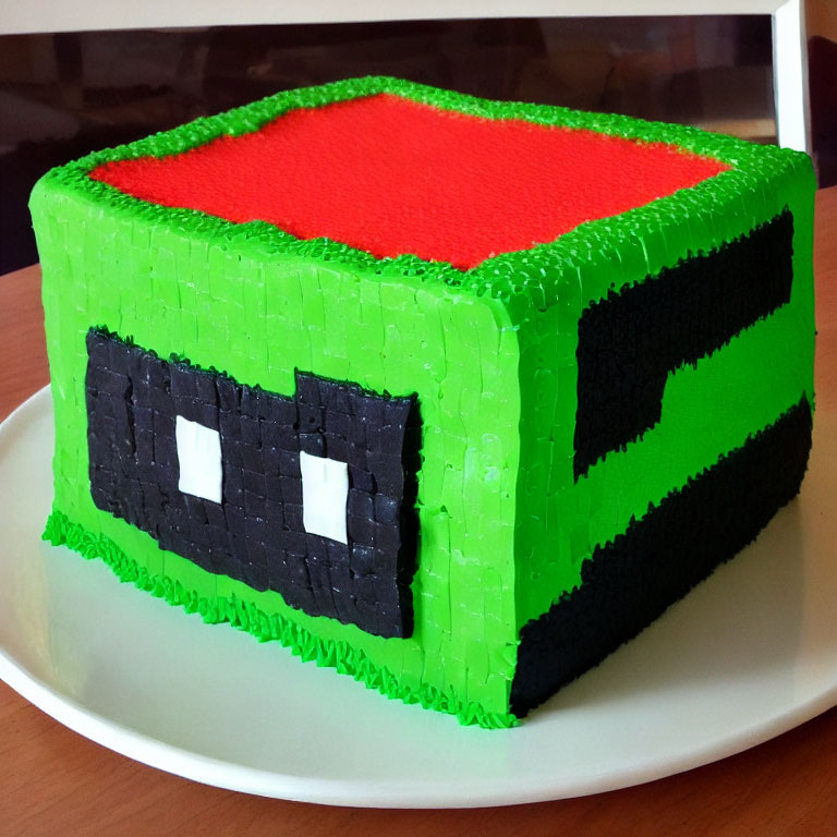 Minecraft Grass Block Cake with Red Top on White Plate