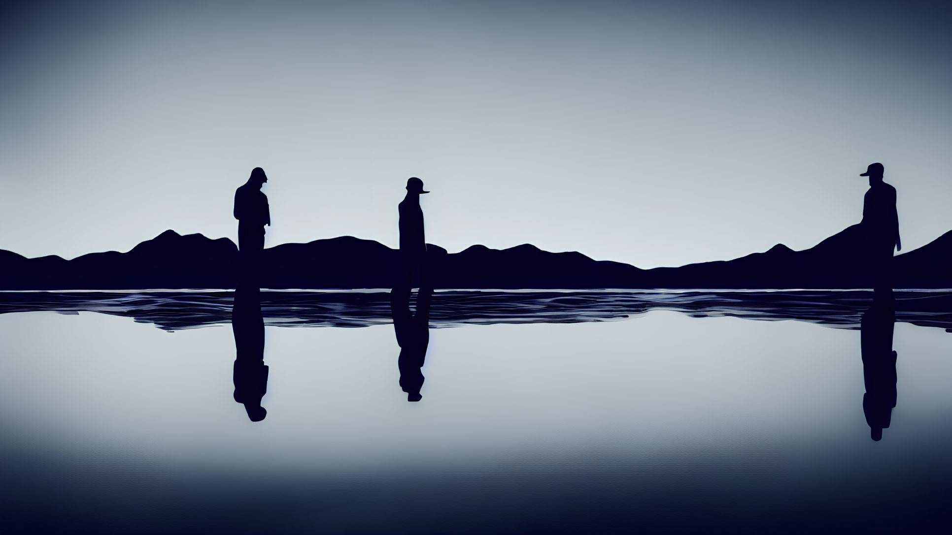 Silhouetted figures by calm water with mountain reflections in blue tones