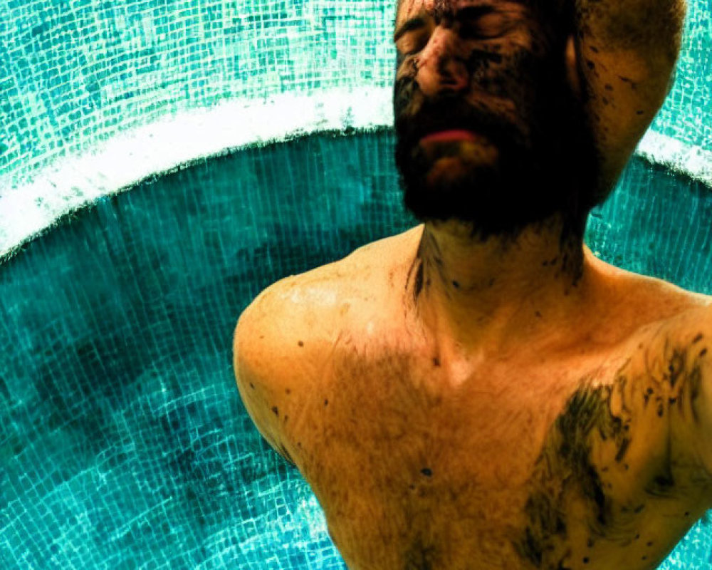 Bearded man in water with vibrant lighting reflections