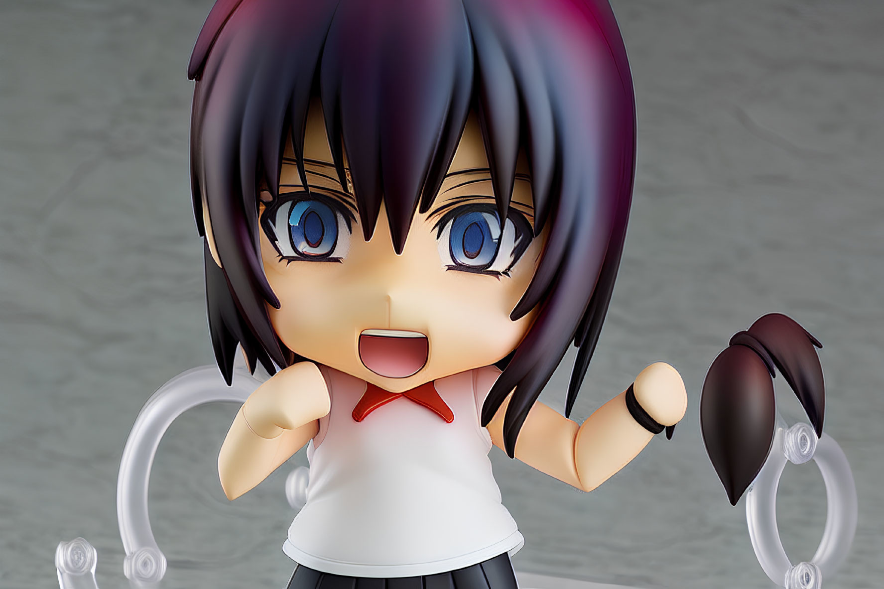 Anime-style figurine with purple-black hair and blue eyes in white top with red tie.