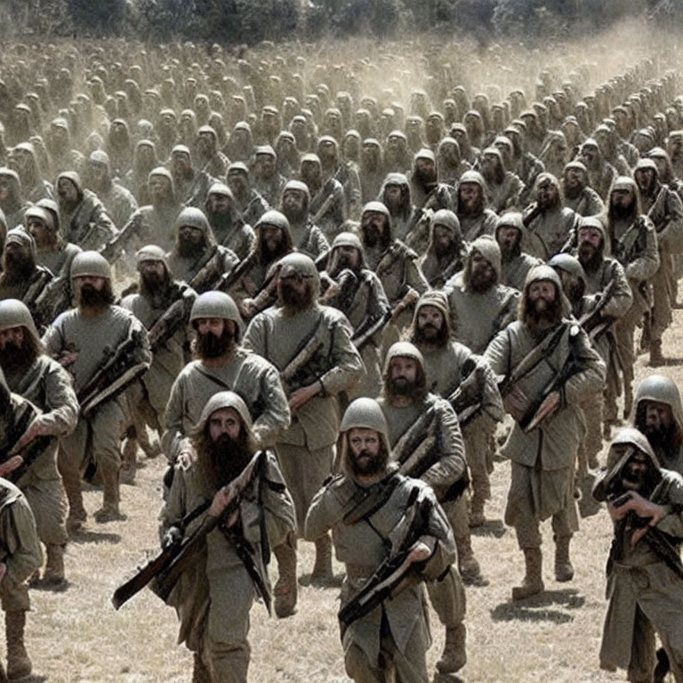 Historical soldiers in costume with rifles marching in dusty field