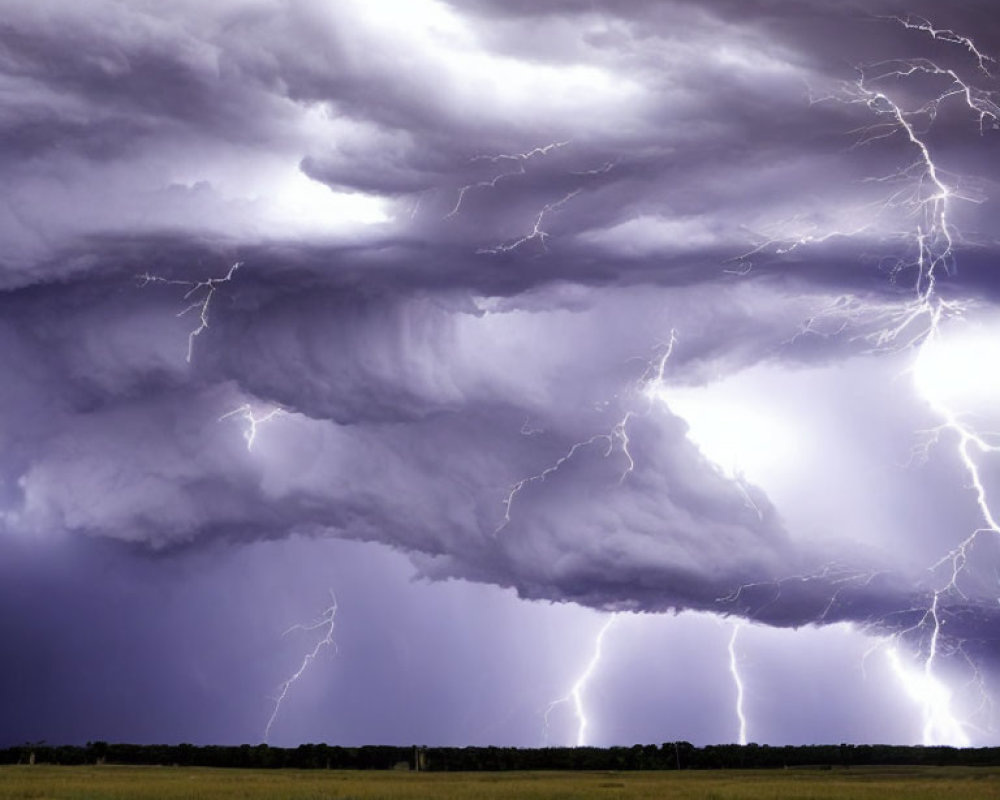 Dramatic thunderstorm with multiple lightning strikes over serene landscape