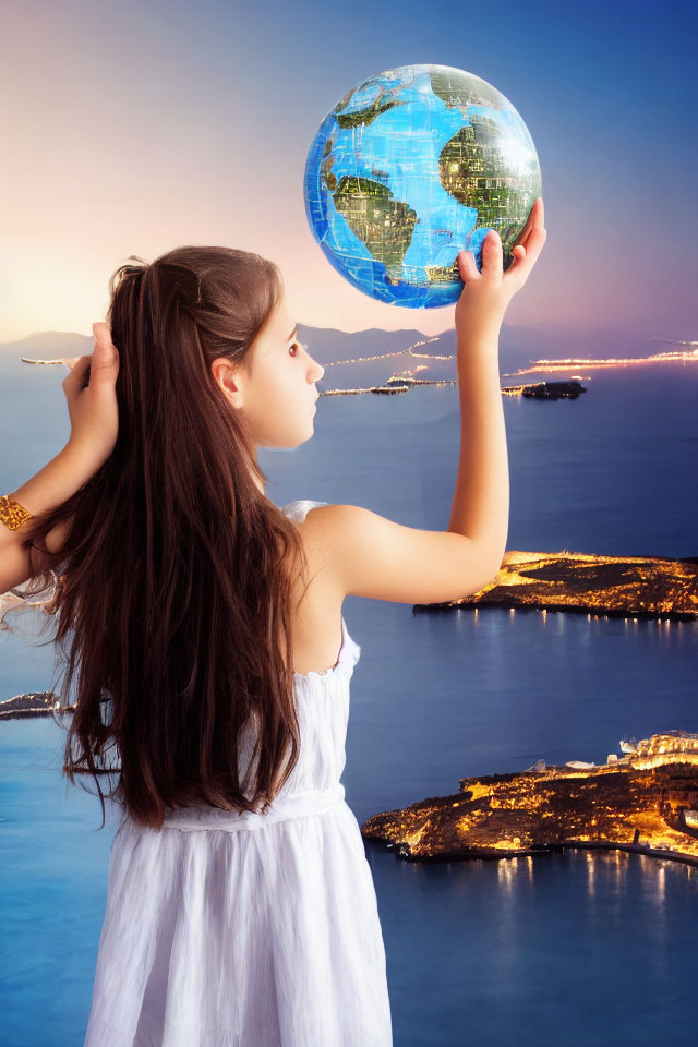 Young girl in white dress holds glowing globe above coastal cityscape at dusk