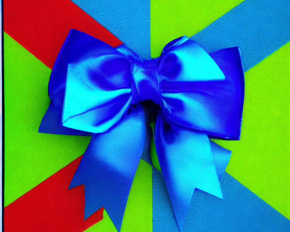 Blue Satin Bow on Bright Geometric Pattern Background in Green, Yellow, Red, Blue