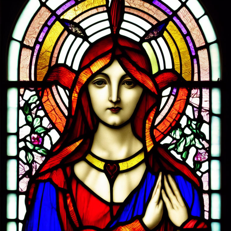 Colorful stained glass artwork of haloed figure with red and orange hair in blue and red robes.