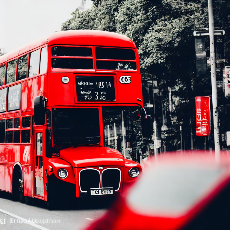 Red Double-Decker Bus on Street with Selective Coloring