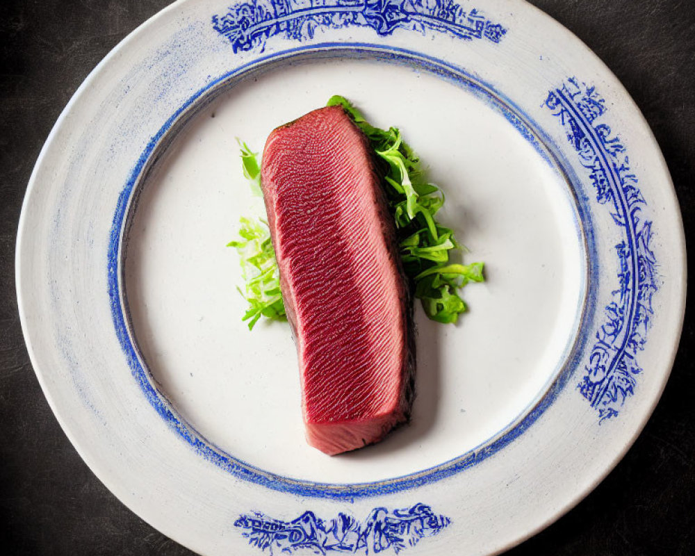 Raw Tuna on Green Salad Platter on Decorative Plate