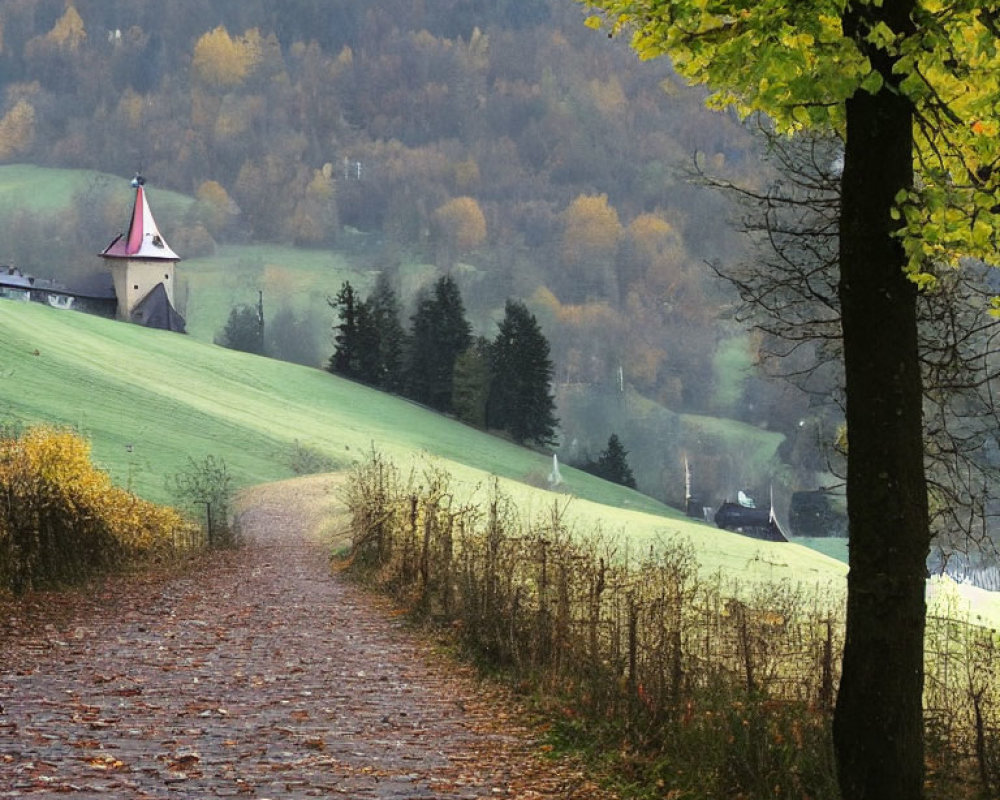 Cobblestone Path Through Autumn Landscape with Church and Hills