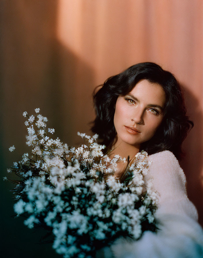 Dark-Haired Woman with Green Eyes Holding White Flower Bouquet