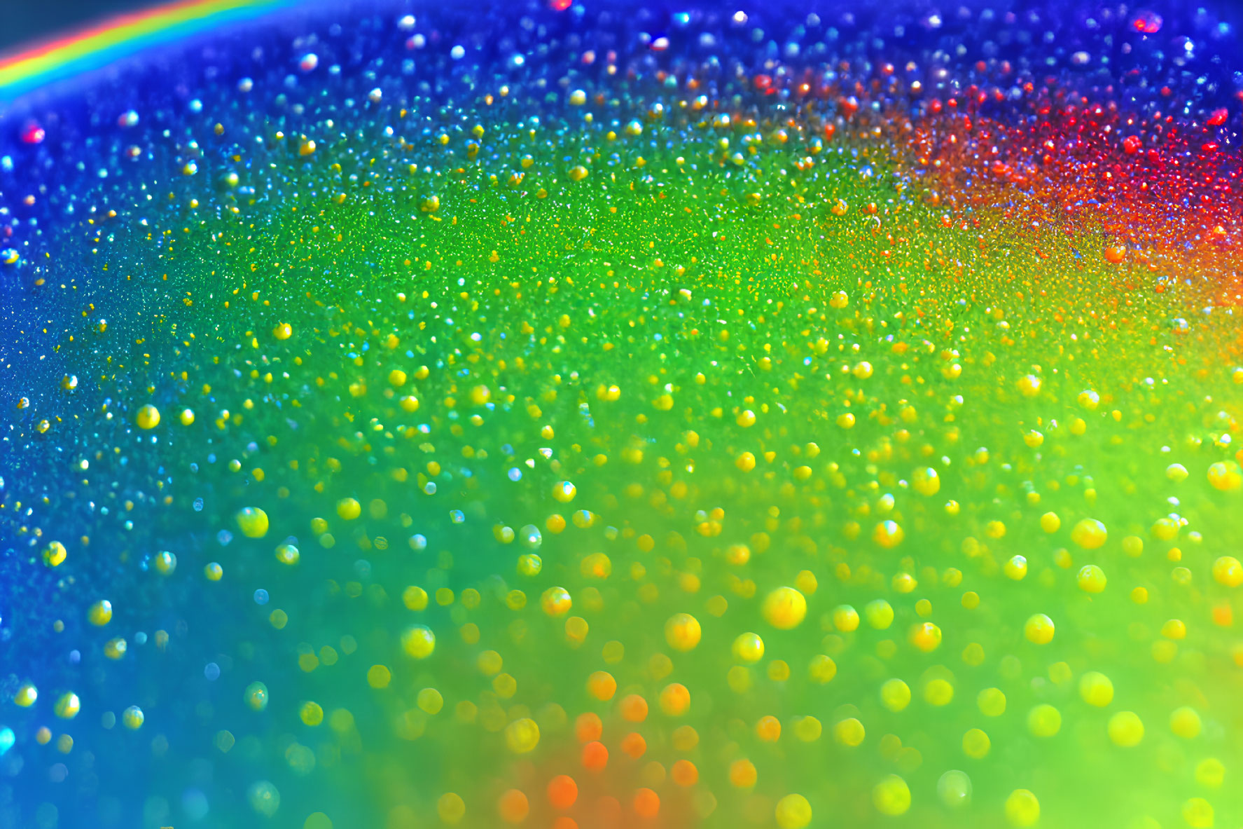 Colorful Water Droplets on Vibrant Background with Soft-focus Rainbow