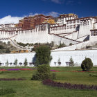 Historic Tibetan Palace Complex with White Walls and Golden Roofs