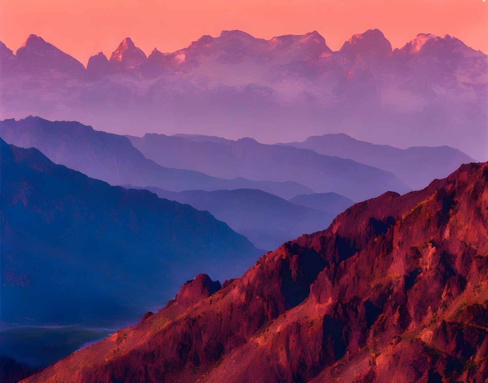 Colorful Sunset Over Layered Mountain Ranges