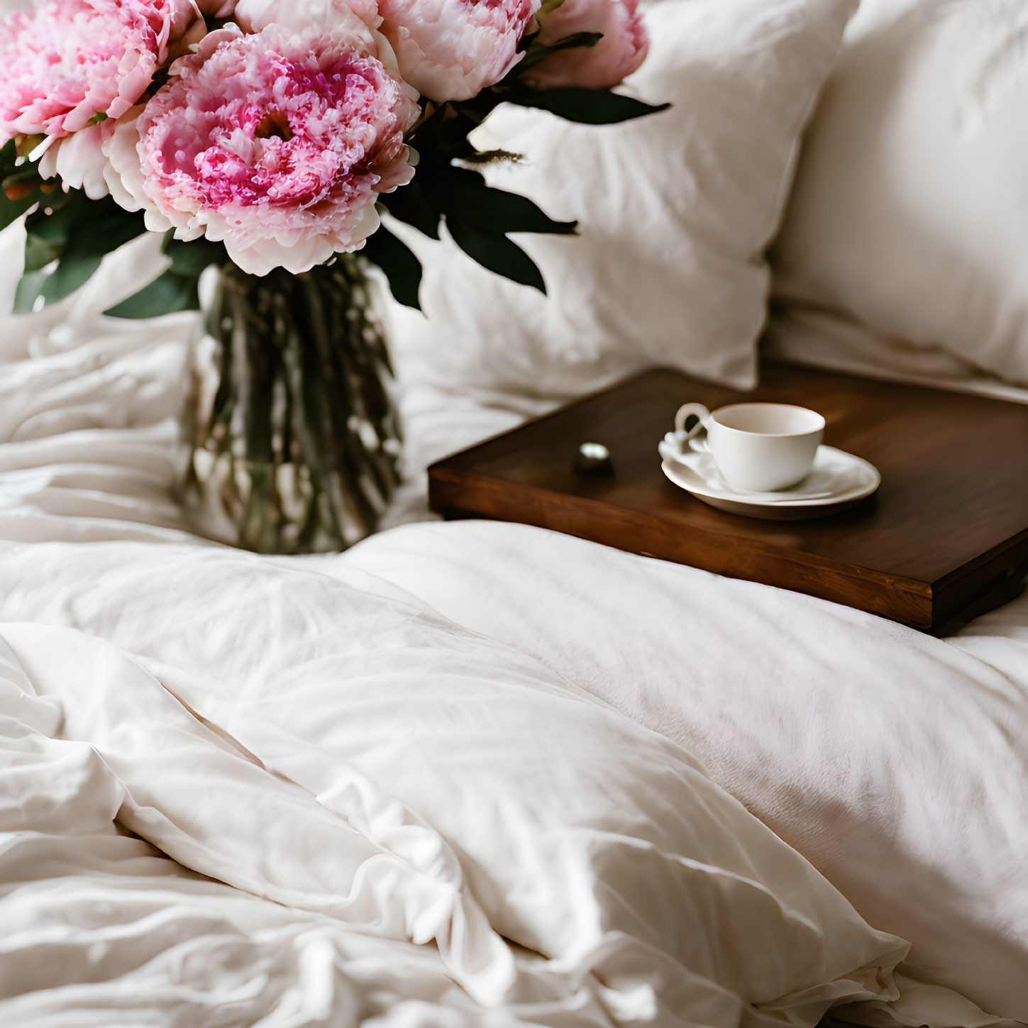 Cozy Bedroom Scene with Wooden Tray, Coffee Cup, and Pink Peonies