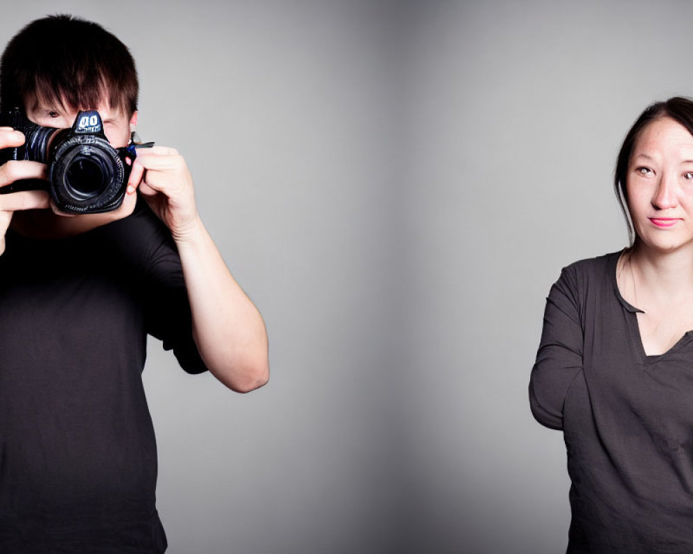 Man with camera covering face photographs skeptical woman against grey background