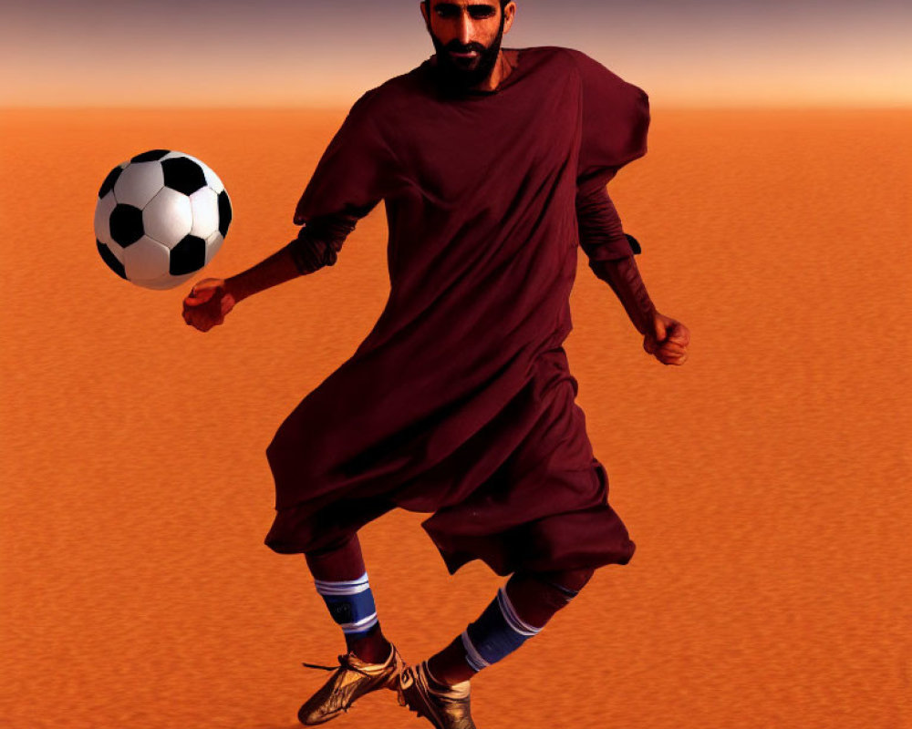 Bearded man in robe and sports shoes balances soccer ball in desert
