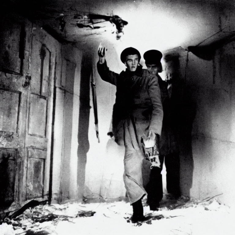 Military men in damaged building with raised hands and pistol.