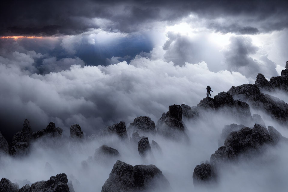 Lone figure in rugged terrain under dramatic dark clouds