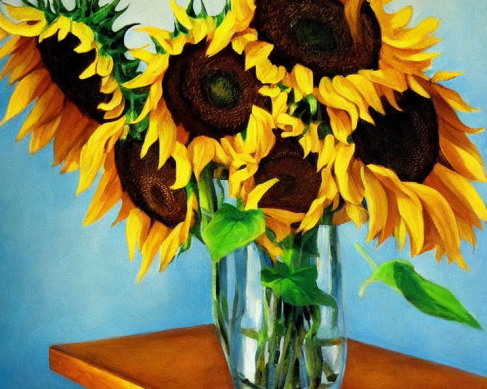 Colorful sunflower bouquet in glass vase on wooden table against blue backdrop