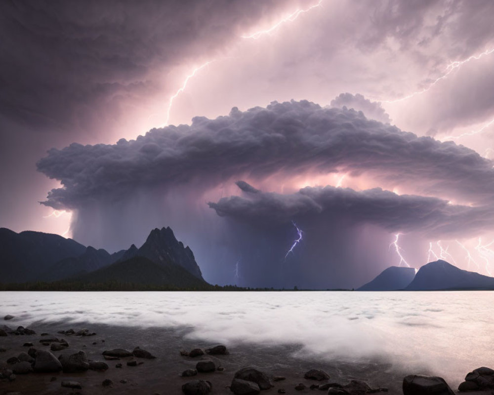 Intense lightning storm over lake and mountains