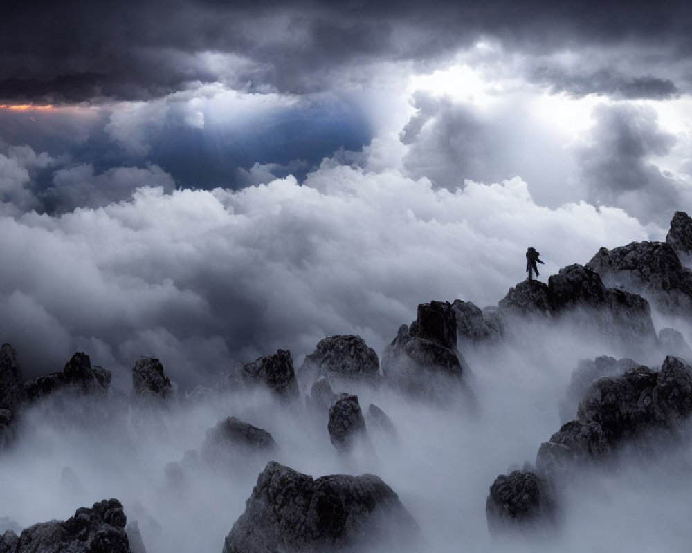 Lone figure in rugged terrain under dramatic dark clouds