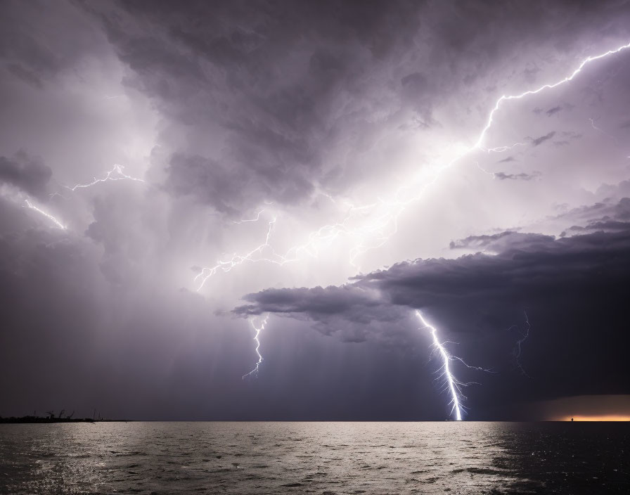 Dramatic ocean thunderstorm with lightning strikes