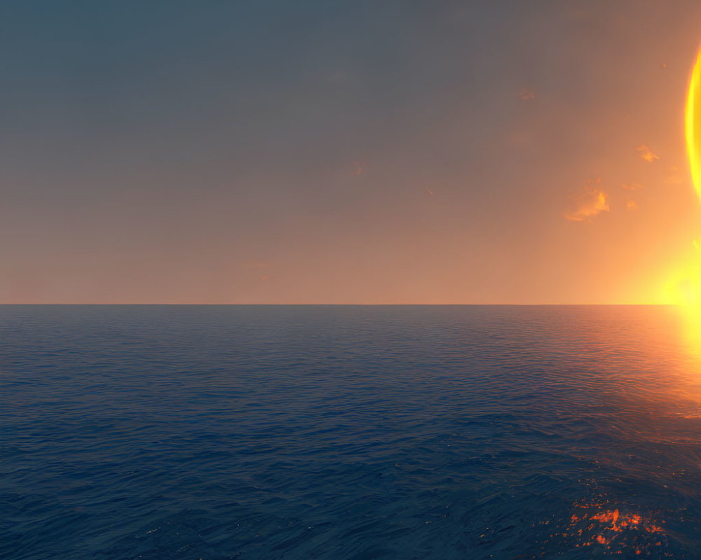 Tranquil ocean sunset with large sun setting below horizon