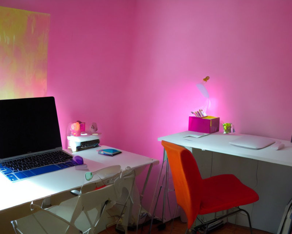 Colorful Home Office with Pink Wall, Laptop, Orange Chair, and Stationery
