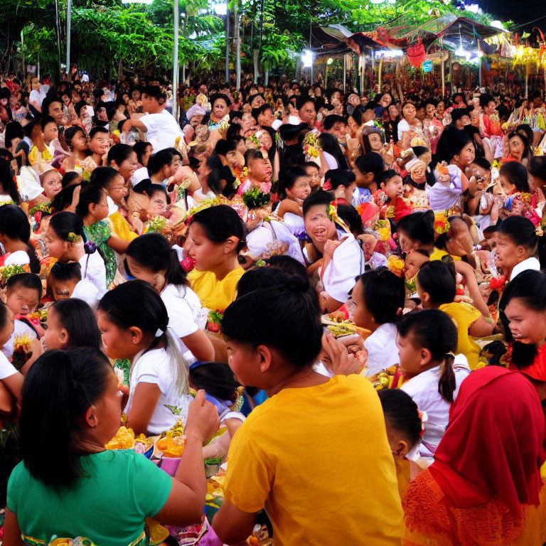 Crowd in Yellow Attire with Flowers at Festive Outdoor Event