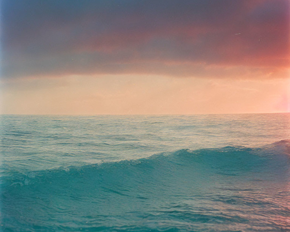 Vintage-Toned Ocean Waves at Sunset Sky Gradient