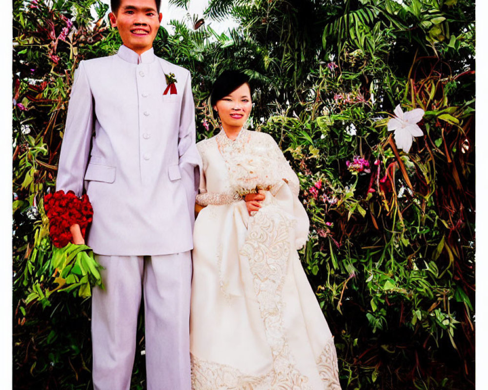 Formal Attire Couple Smiling in Greenery and Flowers