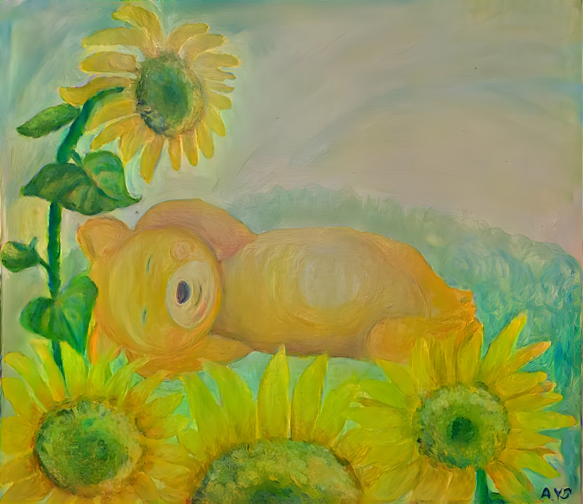  Teddy bear resting in the sunflower garden