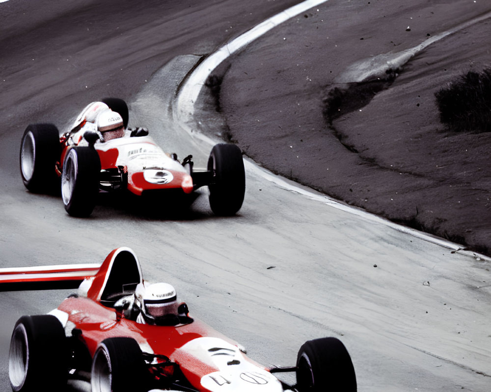 Vintage Formula 1 cars racing on curved track with selective color highlighting.