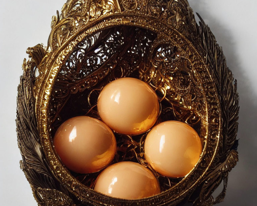 Intricate Decorative Golden Egg Opens to Reveal Nest with Four Lustrous Eggs