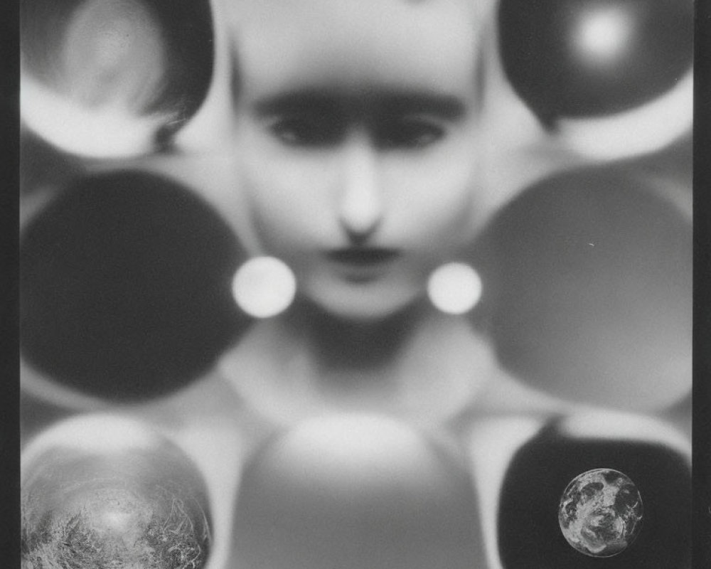 Symmetrical Monochrome Abstract Art with Human-like Figure and Celestial Orbs