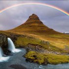 Colorful Aurora Sky Over Mountain Landscape with Waterfalls