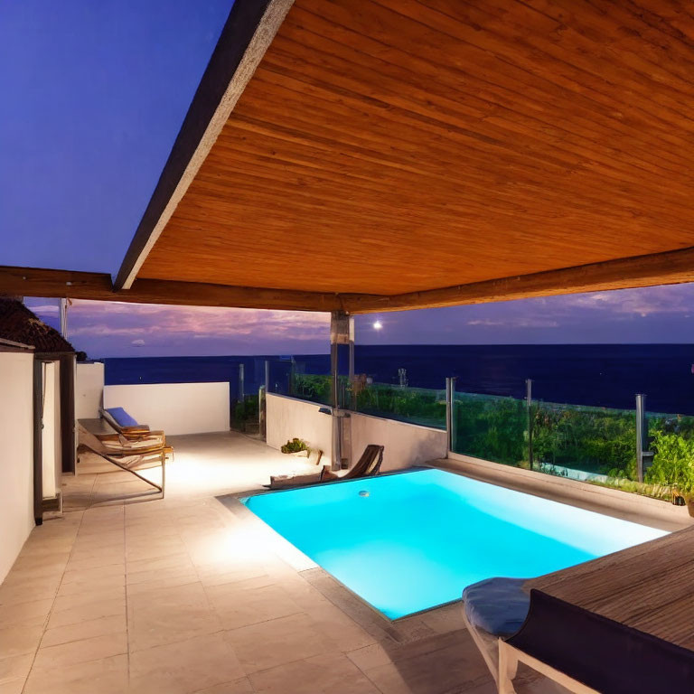 Modern outdoor pool area with ocean view at dusk, wooden overhang and loungers.